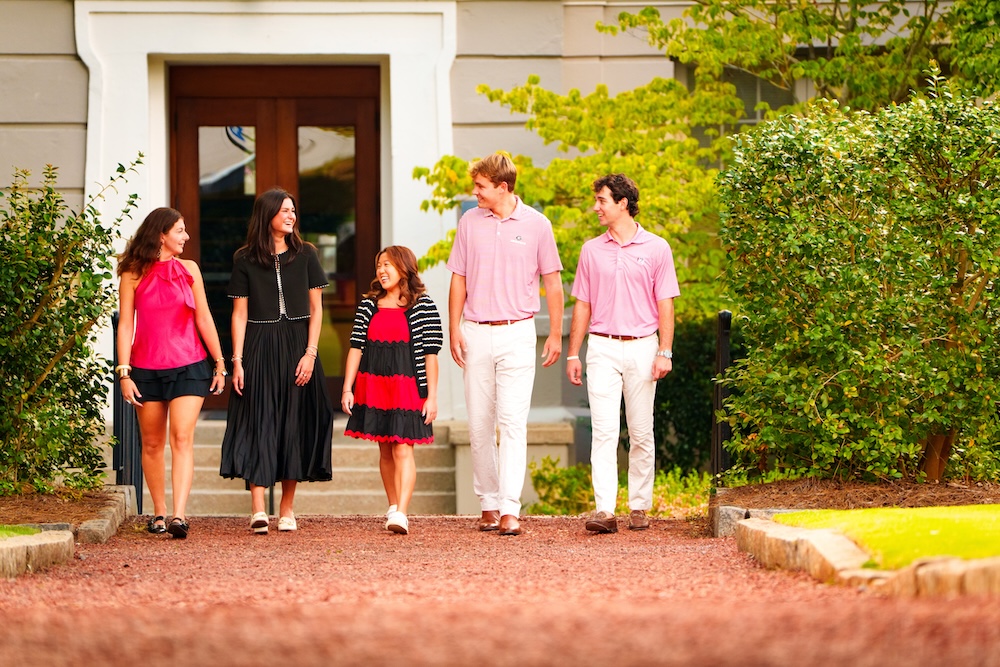 2026 student workers walking in front of building