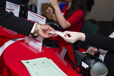 A student receives their name tag at the 2017 Fall Career Fair