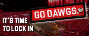 A picture of a keychain that says Go Dawgs and other text saying It's Time to Lock In on top of a picture of Sanford Stadium